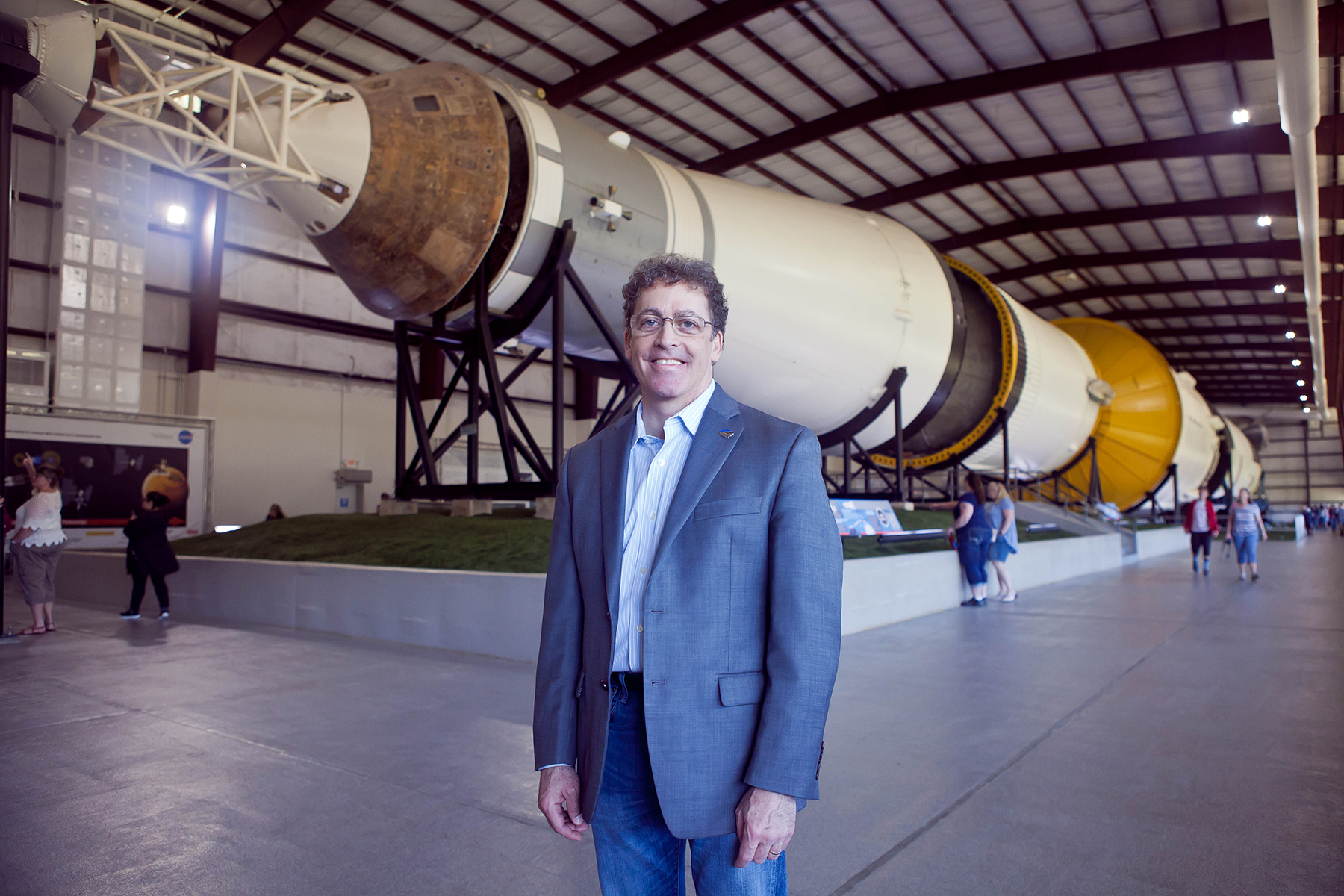 Brian Rishikof standing in front of a rocket