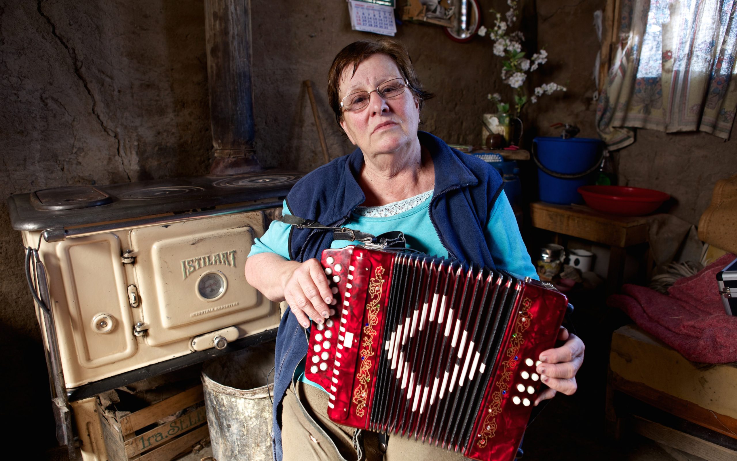 A woman in Patagonia plays her accordion.