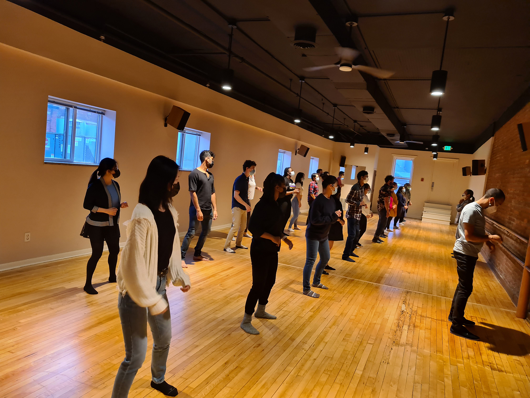 Students dancing in a studio setting.