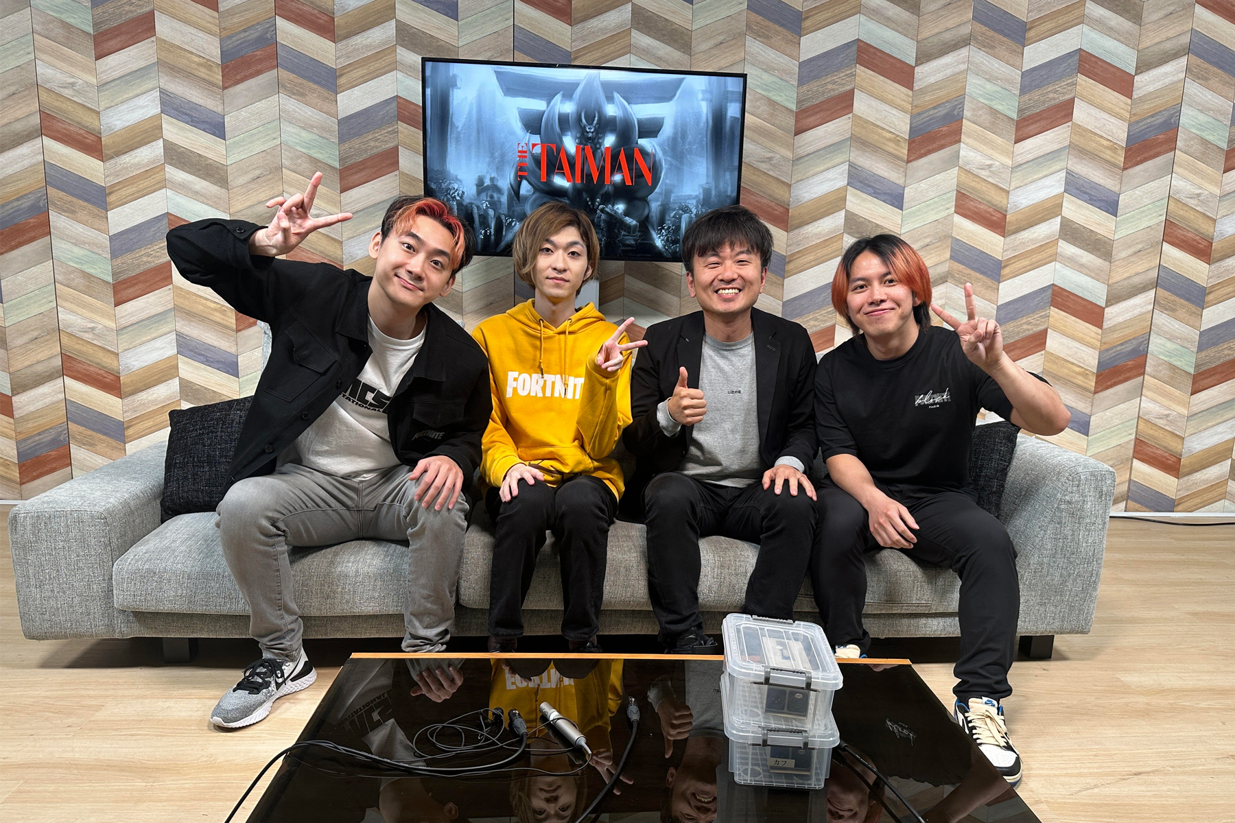 Baro Hyun (second from right) sitting on a couch with Japanese game streamers at an esports event organized by his consulting firm, LunaTone, Inc.