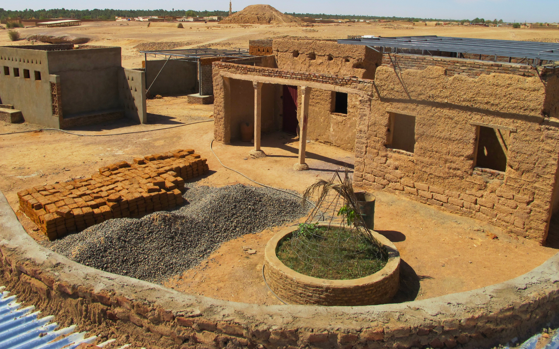 A building with a courtyard in the desert. 