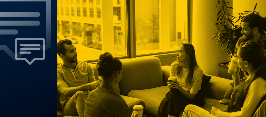 A group of people sitting on couches and chairs having a discussion in a well-lit room.