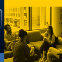 A group of five people sitting in a lounge area having a discussion, holding coffee cups. A blue panel with chat icons is on the left side of the image.