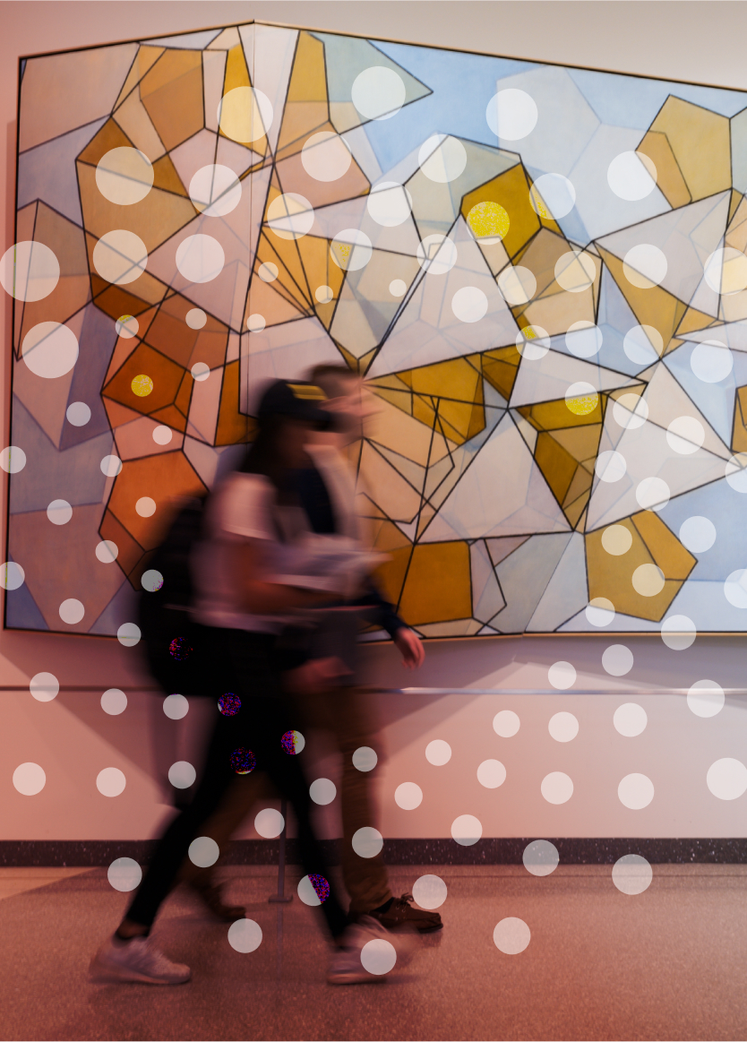 Two people walk past a geometric abstract painting on a wall, with white circular spots overlaid across the image.