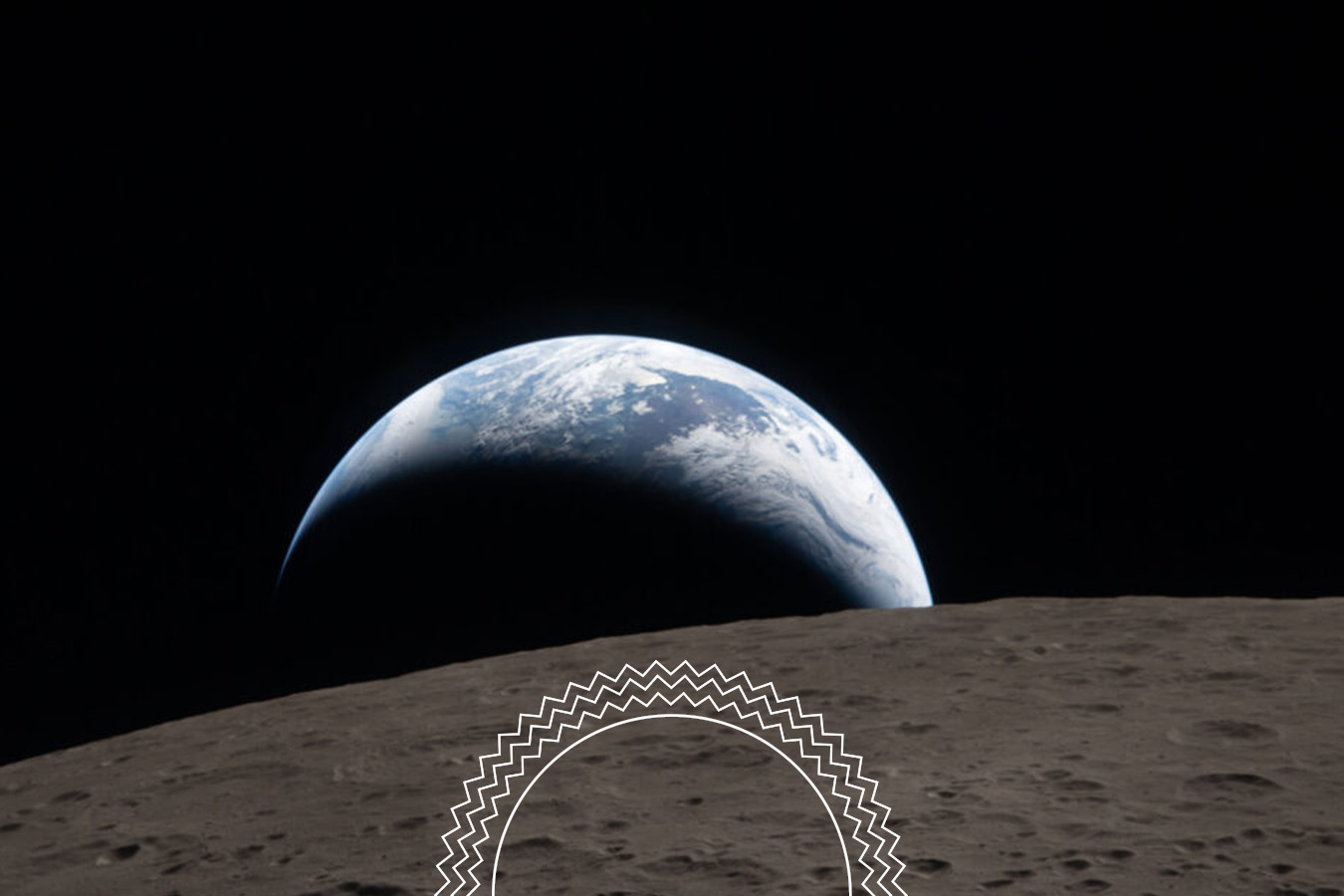 Earthrise seen from the lunar surface, showing part of the moon in the foreground and Earth partially visible against the blackness of space.
