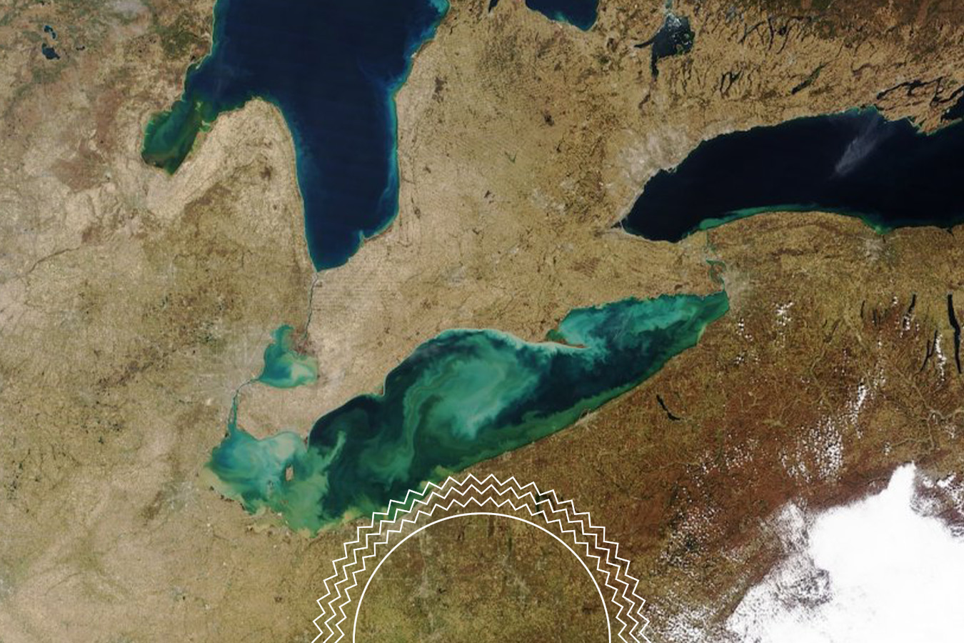 Satellite image of the Great Lakes region showing Lake Erie, Lake Ontario, and nearby land, with a circular zigzag pattern at the bottom center.