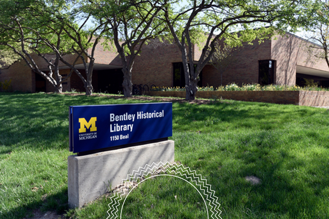 A sign reading “Bentley Historical Library 1150 Beal” stands on a lawn in front of a brick building with trees.