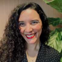 Julianne Armijo smiles for the camera for an informal headshot.