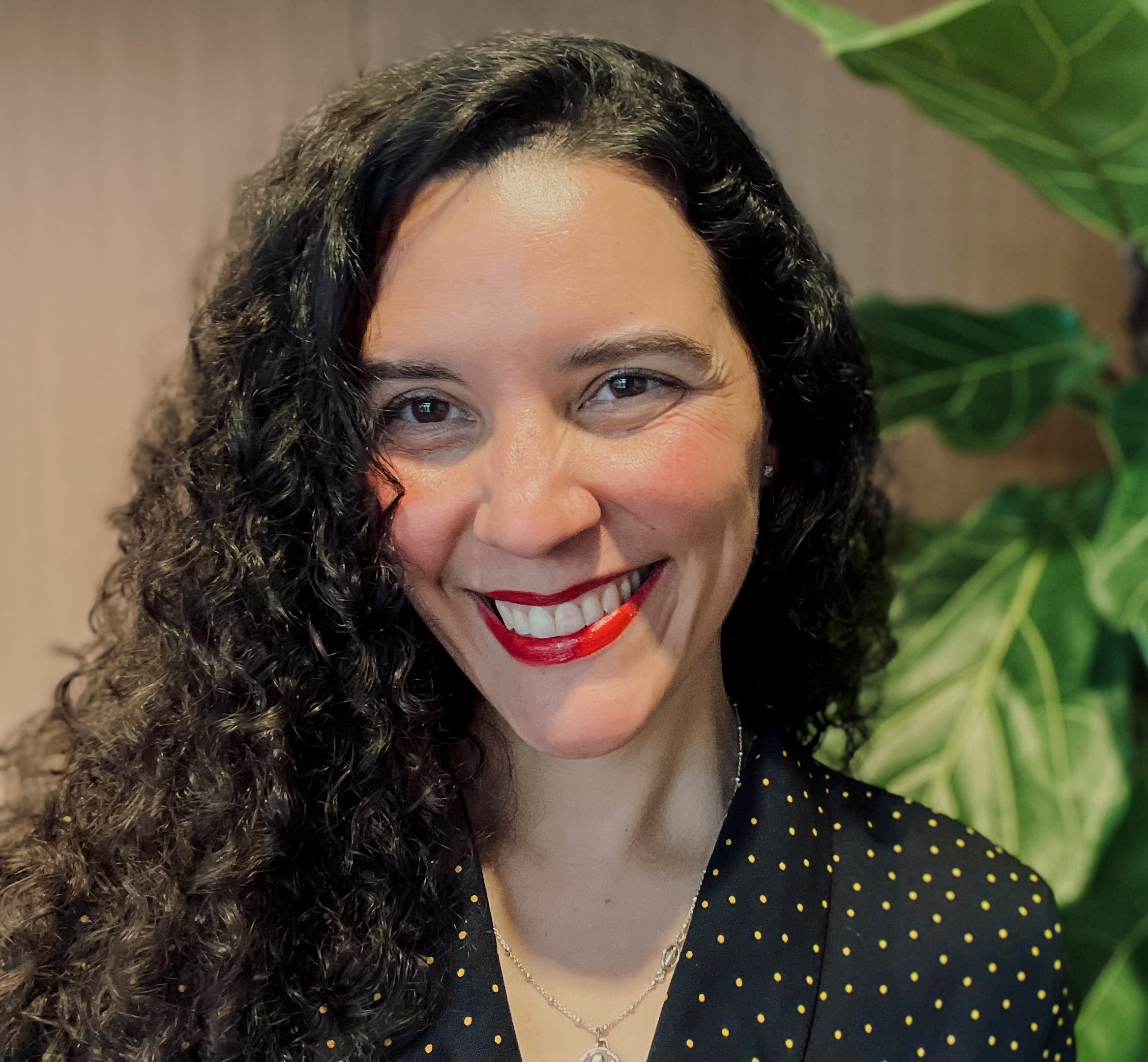 Julianne Armijo smiles for the camera for an informal headshot.